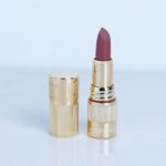guerniss soft burnt matte makeup holding lipstick